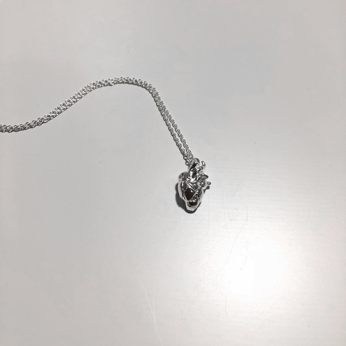 VIKA jewels ONLY LOVE ORGANIC HEART NECKLACE The pendant is a small organic heart 1CM long Timothée chalamet  Hangs on a 40CM or 50CM or 60CM long box chain Handmade in Bali from recycled sterling silver